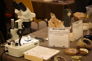 rocks and a microscope on a table
